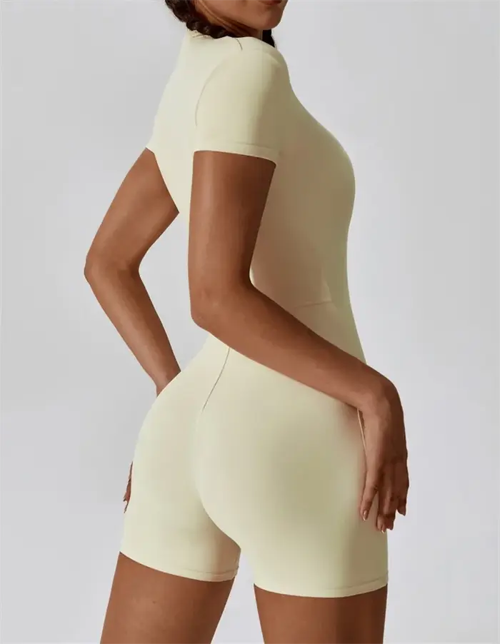 Combinaison de yoga une pièce nue européenne et américaine avec col montant, demi-fermeture éclair,
